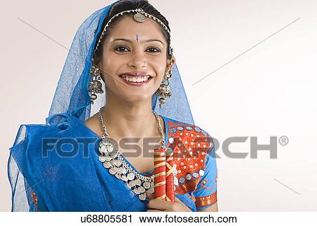 Gujarati woman with dandiya sticks View Large Photo Image Stock Image - Gujarati woman with dandiya sticks . Fotosearch