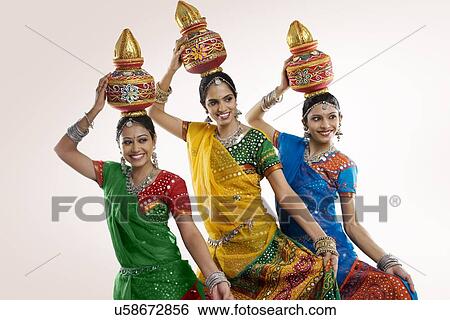 Stock Photograph - Gujarati women holding a kalash . Fotosearch