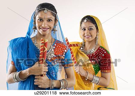 Stock Photo - Gujarati women with dandiya sticks . Fotosearch
