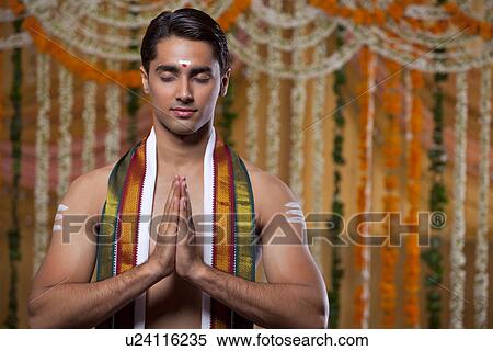 Handsome groom praying View Large Photo Image Stock Photography - Handsome groom praying . Fotosearch