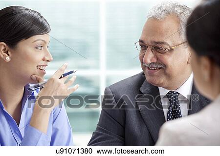 Happy businesspeople having healthy conversation View Large Photo Image Stock Image - Happy businesspeople having healthy conversation . Fotosearch