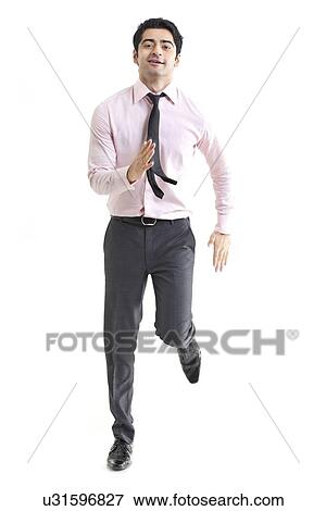 Happy young businessman running over white background View Large Photo Image Stock Photo - Happy young businessman running over white background . Fotosearch