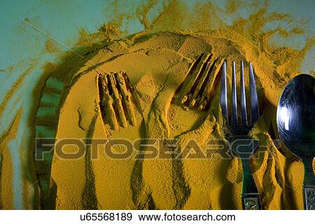 Stock Photo - Impressions on turmeric powder . Fotosearch