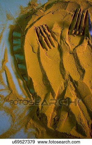 Impressions on turmeric powder View Large Photo Image Stock Photo - Impressions on turmeric powder . Fotosearch