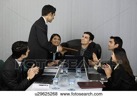 Stock Photo - In a meeting . Fotosearch