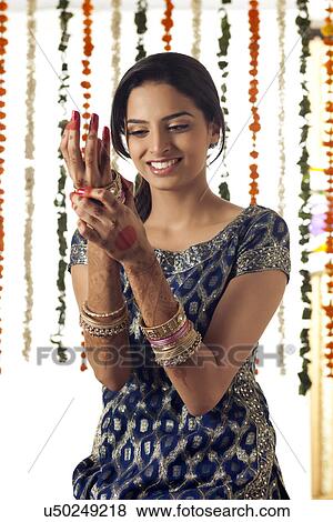 Stock Photo - Indian bride wearing bangles . Fotosearch
