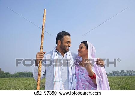 Indian couple smiling while looking at each other View Large Photo Image Stock Image - Indian couple smiling while looking at each other . Fotosearch