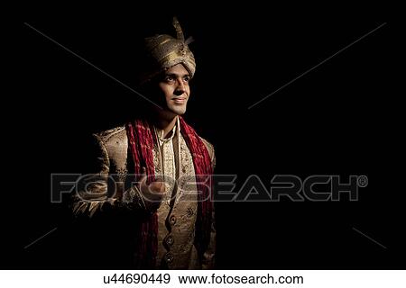 Stock Photo - Indian groom in traditional attire . Fotosearch
