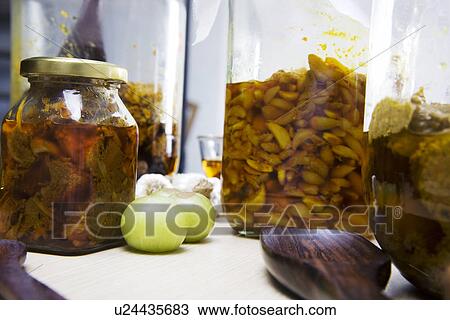 Stock Image - Jars filled with pickle . Fotosearch