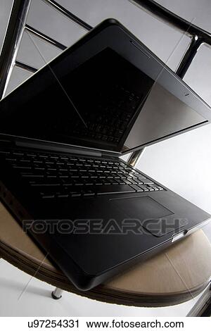 Laptop on a chair View Large Photo Image Stock Image - Laptop on a chair . Fotosearch
