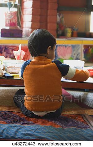 Stock Image - Little boy painting . Fotosearch