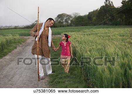 Stock Photography - Little girl taking a walk with her father . Fotosearch