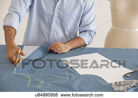 Male fashion designer working in fashion studio View Large Photo Image Stock Photograph - Male fashion designer working in fashion studio . Fotosearch