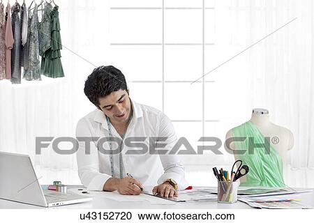 Male fashion designer working in studio View Large Photo Image Stock Image - Male fashion designer working in studio . Fotosearch