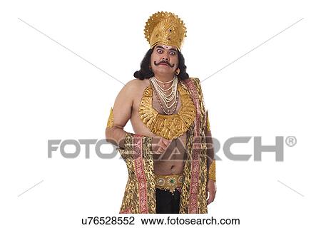 Stock Image - Man dressed as Raavan looking serious . Fotosearch
