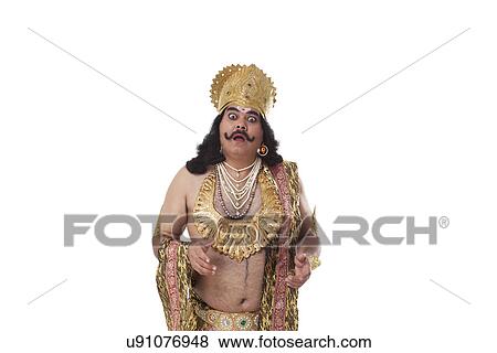 Stock Photo - Man dressed as Raavan looking shocked . Fotosearch