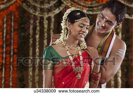 Man fastening necklace on woman View Large Photo Image Stock Photo - Man fastening necklace on woman . Fotosearch