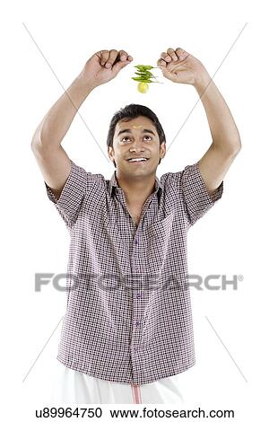 Man holding lemon and chillies View Large Photo Image Stock Image - Man holding lemon and chillies . Fotosearch