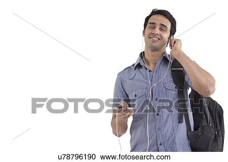 Man listening to music with eyes closed View Large Photo Image Stock Image - Man listening to music with eyes closed . Fotosearch