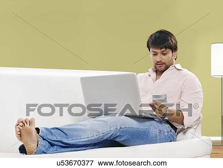 Man net banking View Large Photo Image Stock Photo - Man net banking . Fotosearch
