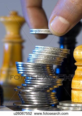 Man stacking coins View Large Photo Image Stock Image - Man stacking coins . Fotosearch