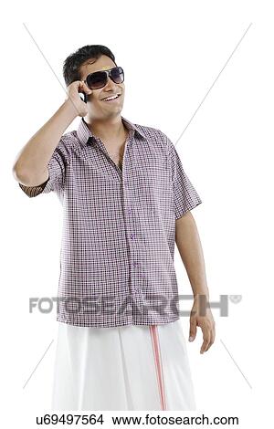 Picture - Man talking on a mobile phone . Fotosearch