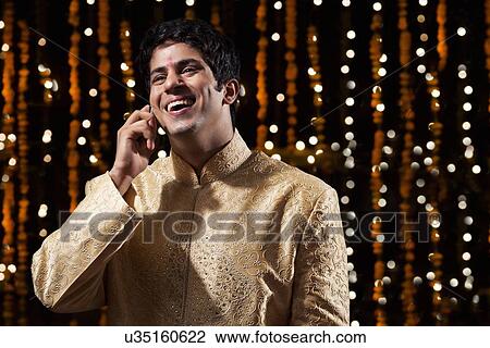 Man talking on a mobile phone View Large Photo Image Stock Image - Man talking on a mobile phone. Fotosearch