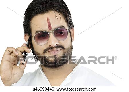 Stock Image - Man talking on a mobile phone . Fotosearch
