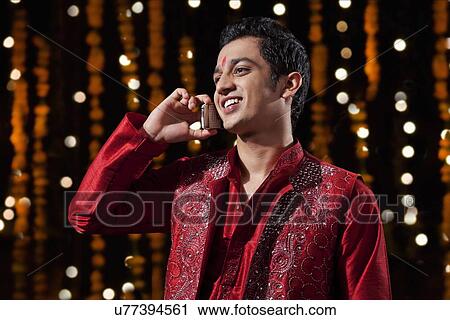 Man talking on a mobile phone View Large Photo Image Stock Image - Man talking on a mobile phone. Fotosearch