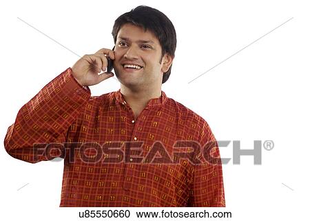 Man talking on a mobile phone View Large Photo Image Stock Image - Man talking on a mobile phone . Fotosearch