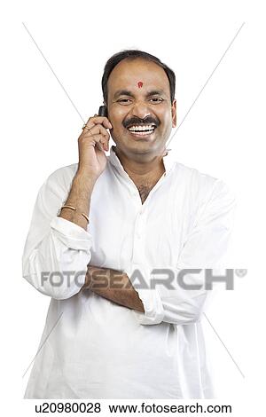 Man talking on a mobile phone View Large Photo Image Stock Photo - Man talking on a mobile phone . Fotosearch