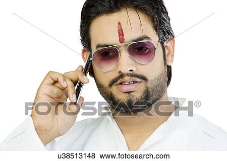 Man talking on a mobile phone View Large Photo Image Stock Photo - Man talking on a mobile phone . Fotosearch