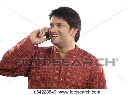 Stock Photo - Man talking on a mobile phone . Fotosearch