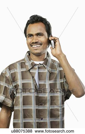 Man talking on a mobile phone View Large Photo Image Stock Photo - Man talking on a mobile phone . Fotosearch