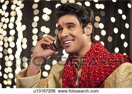 Man talking on a mobile phone View Large Photo Image Stock Photograph - Man talking on a mobile phone. Fotosearch