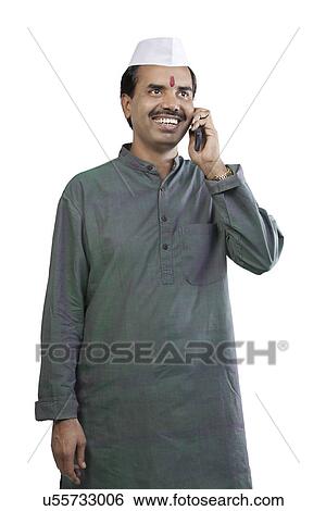 Stock Photograph - Man talking on a mobile phone . Fotosearch