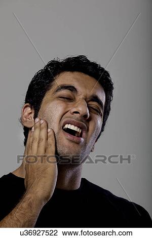 Stock Image - Man with a toothache . Fotosearch