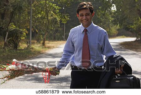 Man with flower View Large Photo Image Stock Photo - Man with flower . Fotosearch