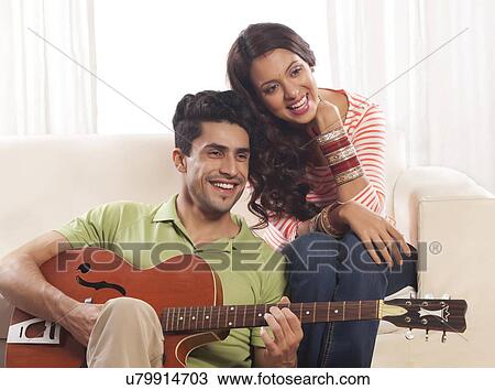 Married couple with guitar View Large Photo Image Stock Image - Married couple with guitar. Fotosearch