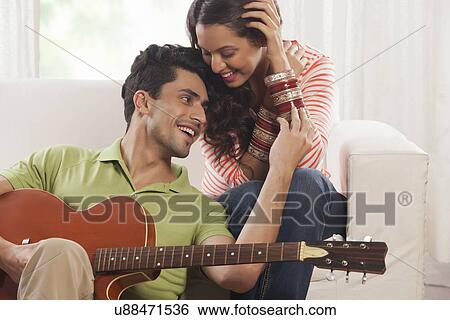 Married couple with guitar View Large Photo Image Stock Photograph - Married couple with guitar. Fotosearch