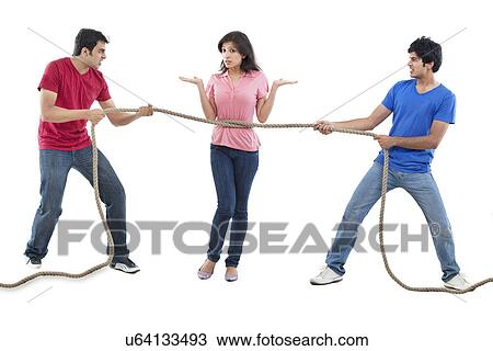 Men competing for woman in tug of war View Large Photo Image Stock Image - Men competing for woman in tug of war . Fotosearch