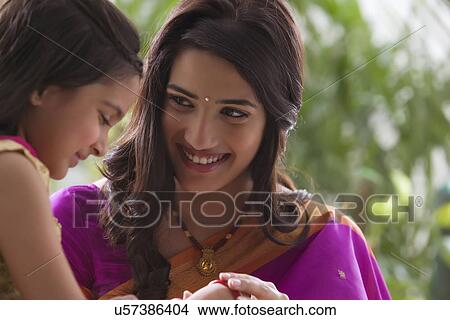 Mother and daughter enjoying View Large Photo Image Picture - Mother and daughter enjoying . Fotosearch