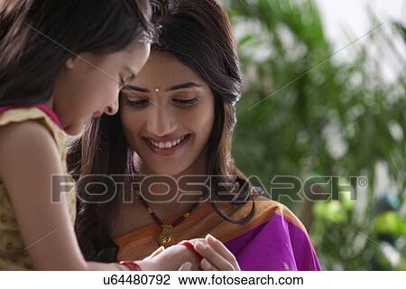 Stock Image - Mother and daughter enjoying . Fotosearch