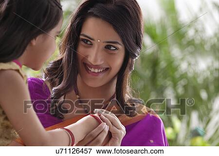 Stock Photo - Mother and daughter enjoying . Fotosearch