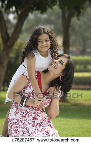 Stock Photo - Mother and daughter having fun . Fotosearch