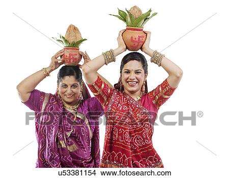 Mother and daughter holding Kalash View Large Photo Image Picture - Mother and daughter holding Kalash . Fotosearch