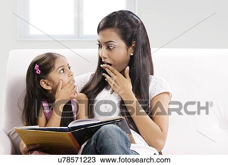 Mother and daughter looking at each other amazed View Large Photo Image Stock Image - Mother and daughter looking at each other amazed . Fotosearch