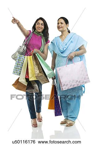 Stock Photograph - Mother and daughter shopping . Fotosearch