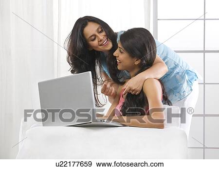 Stock Photo - Mother and daughter spending time together . Fotosearch