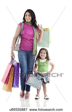 Mother and daughter with shopping bags View Large Photo Image Stock Photo - Mother and daughter with shopping bags . Fotosearch